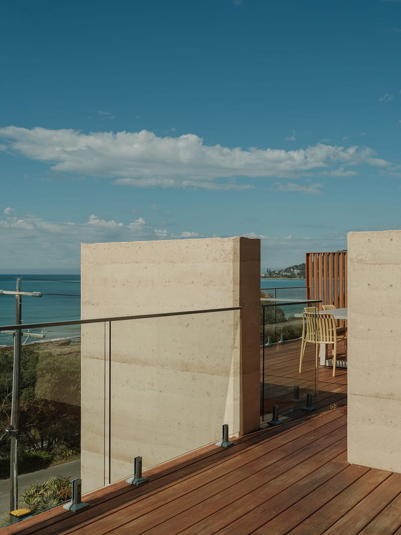 Rammed earth balcony walls overlooking the ocean at Hall St Lorne on the Great Ocean Road
